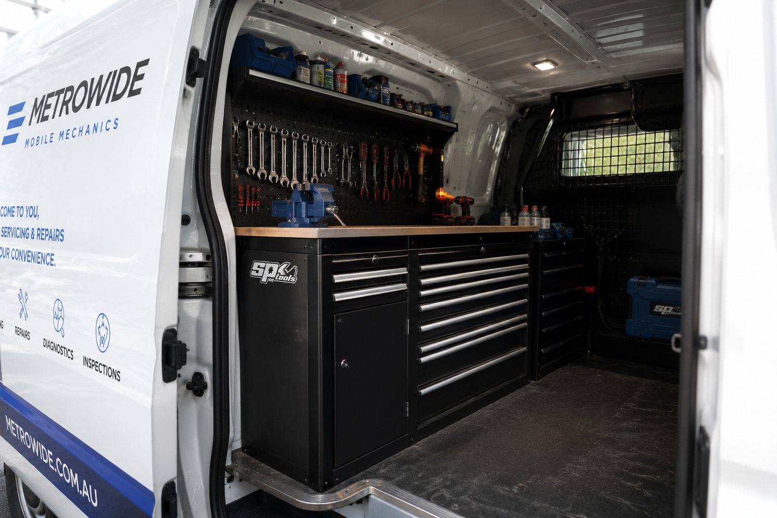 Placeholder - inside Mohammed's MetroWide van showing organised tool wall and SP Tools workbench. Real portrait coming before launch.